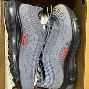 These are the Nike Air Max 97s , Grey and black with a hint of pink on the Nike